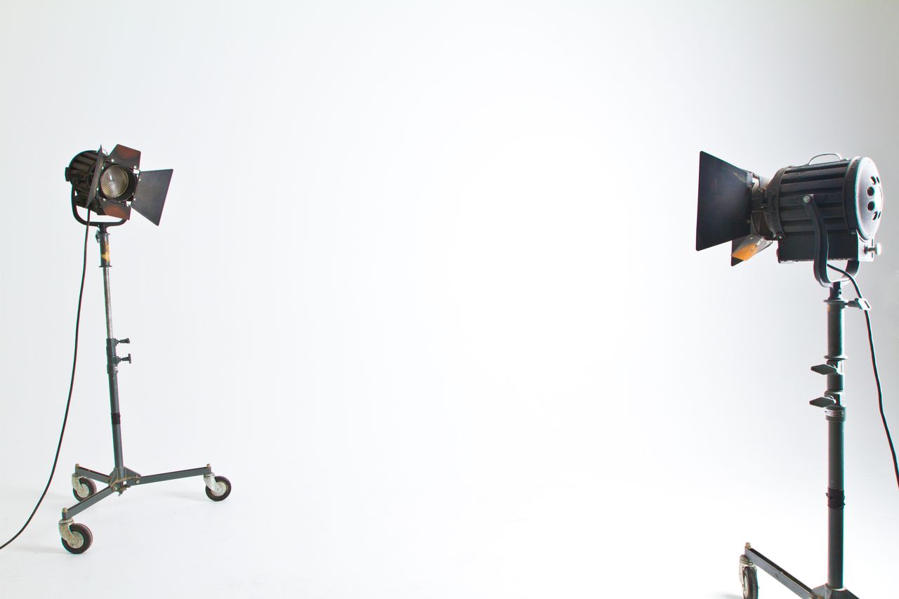 The Art of Drawing Readers In: Your attractive post title goes here Studio floodlights set up in a professional photography environment with clean background.