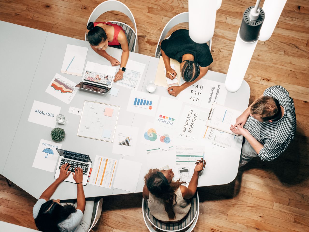 Mastering the First Impression: Your intriguing post title goes here Diverse team collaborating on marketing strategy in a modern office setting.
